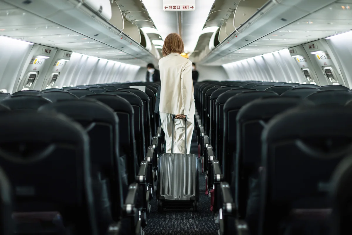 Businesswoman traveling on an airplane