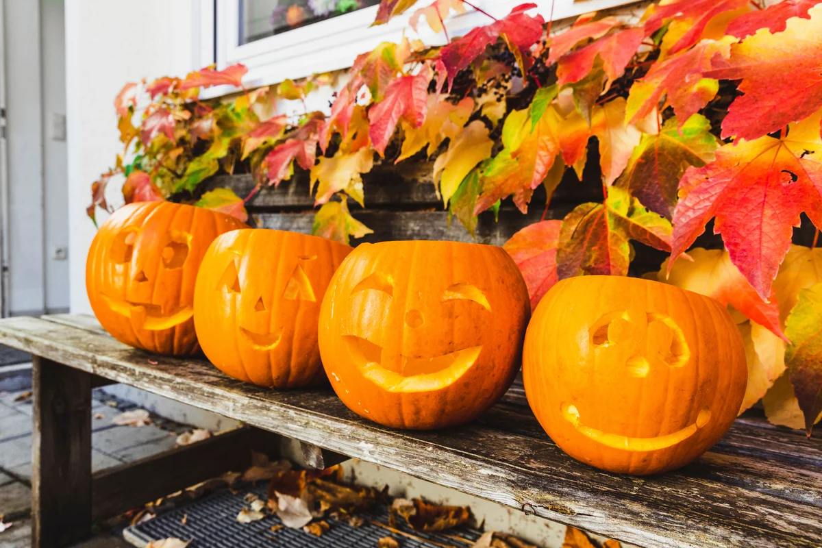 jack-o'-lanterns on a bench