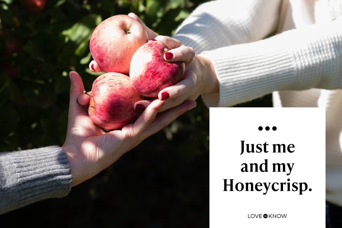 Man and woman holding Honeycrisp apples