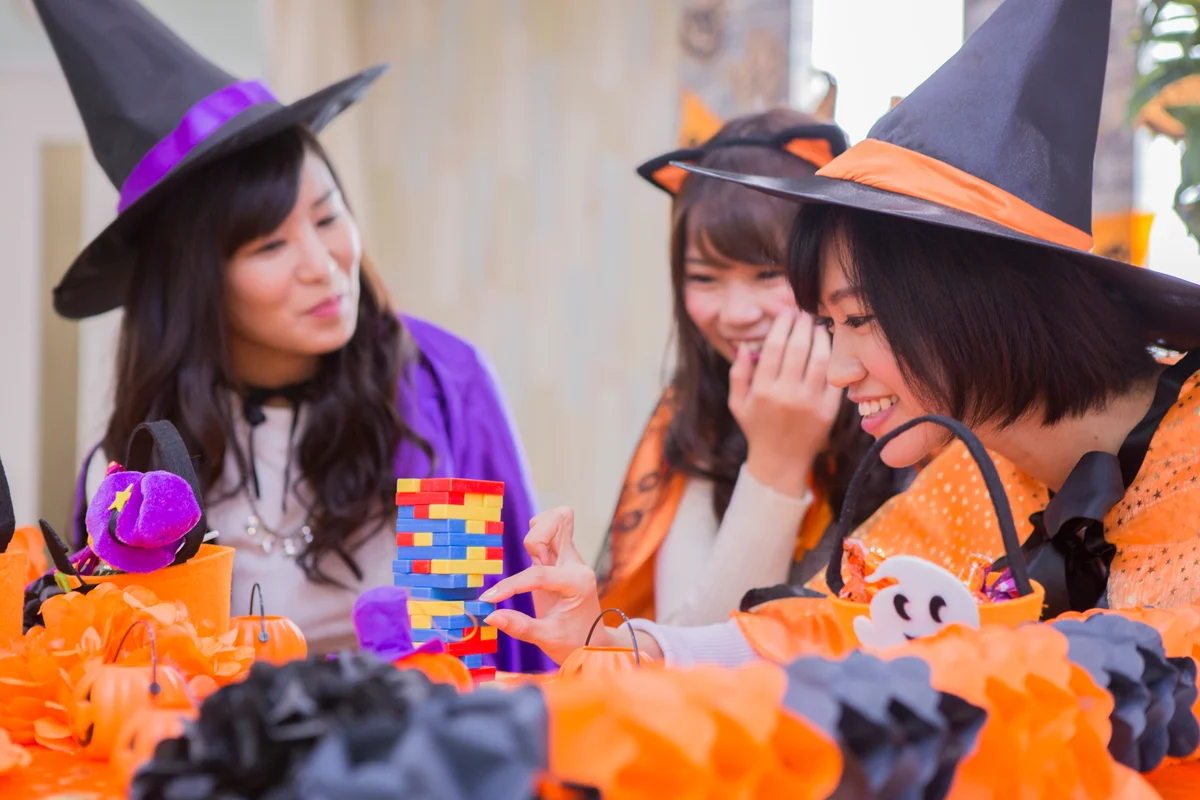 adults in costume playing Jenga