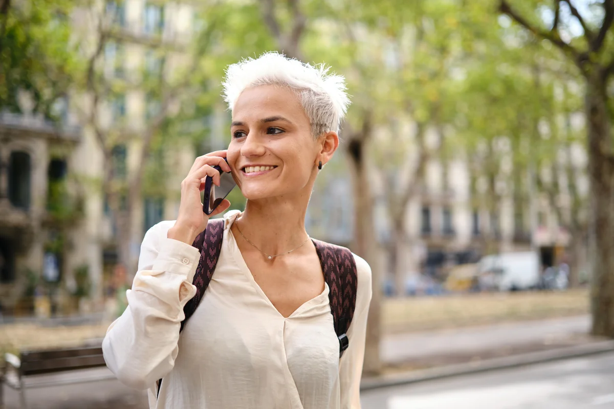 Person talking on phone and smiling