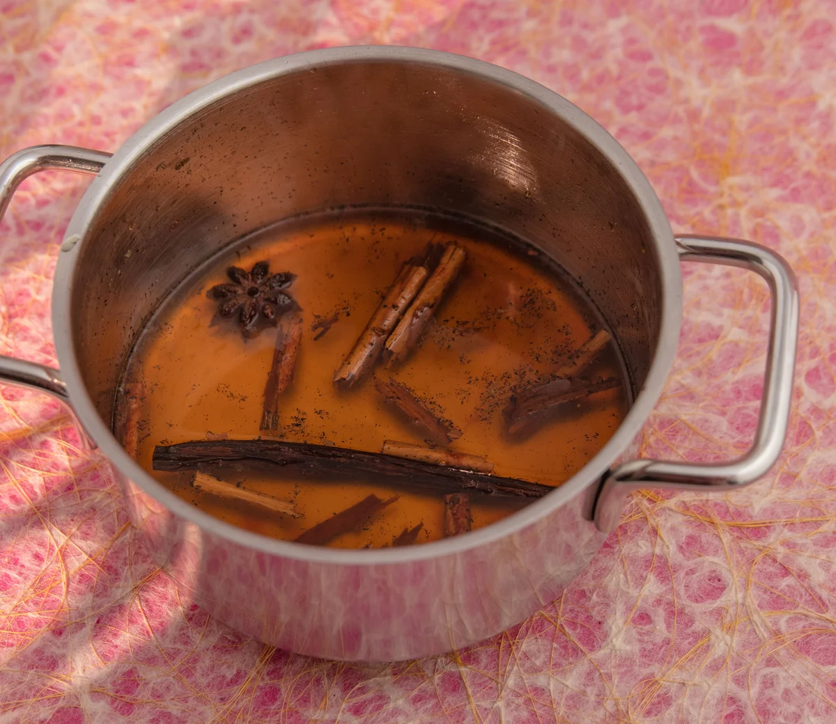 Pot with cinnamon and spices