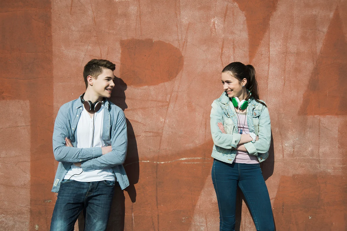 Teenage boy and teenage girl communicating