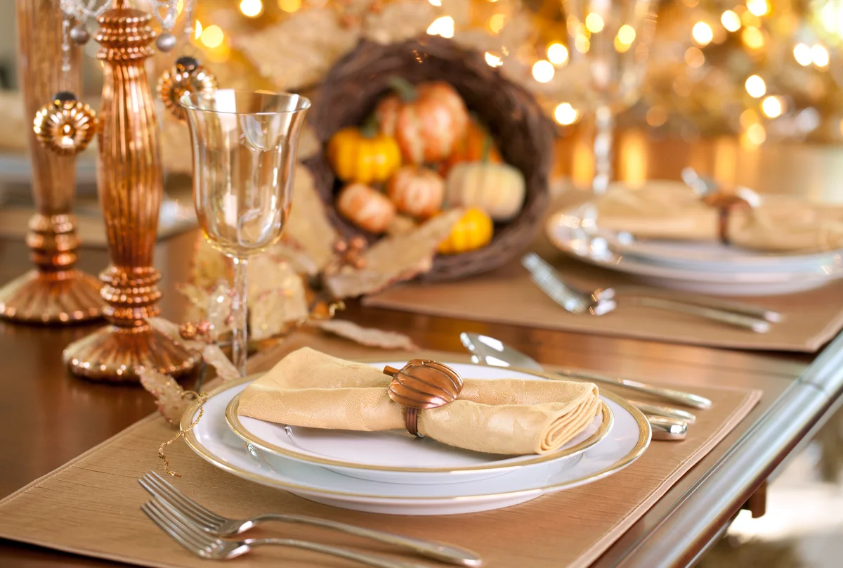 Fall table decorated with warm metals