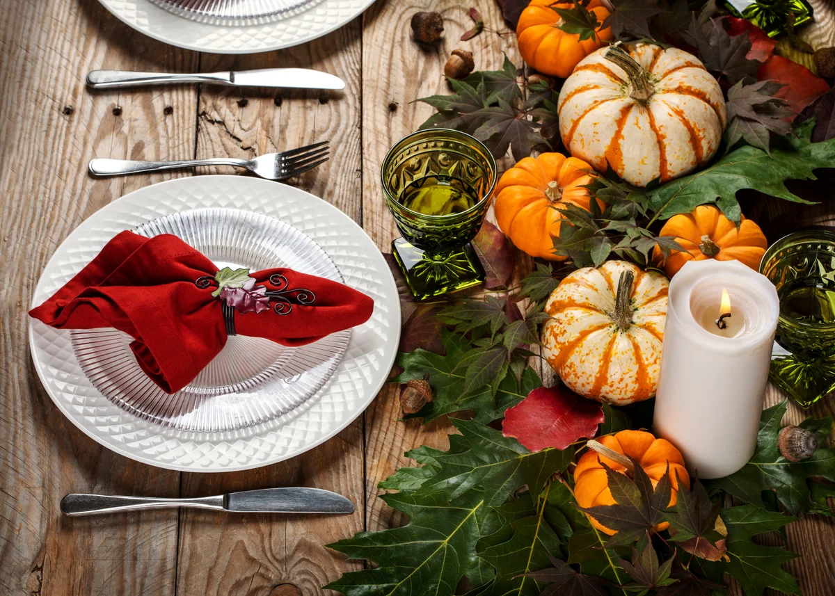 table decorated with real mini pumpkins