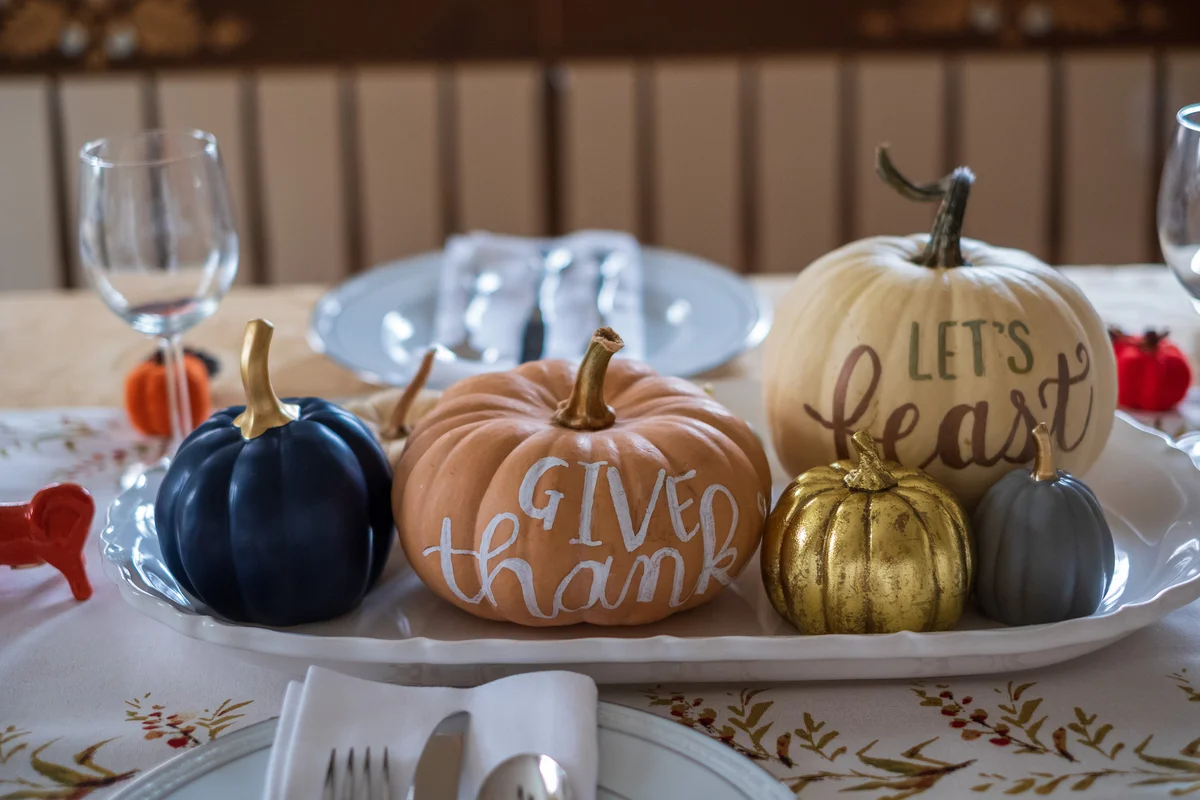 Pumpkins painted with cute fall sayings