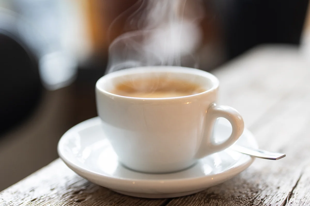 Refreshing hot cup of coffee at a cafe