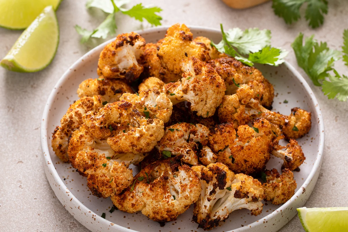 Spicy roasted cauliflower served with lime and cilantro