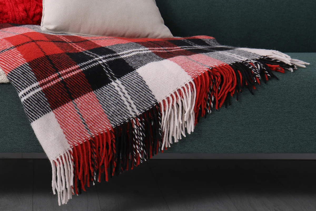 Sofa with soft pillows and warm plaids