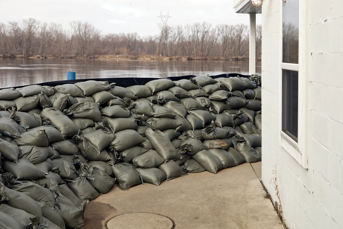 Sandbag wall in defense of river flood