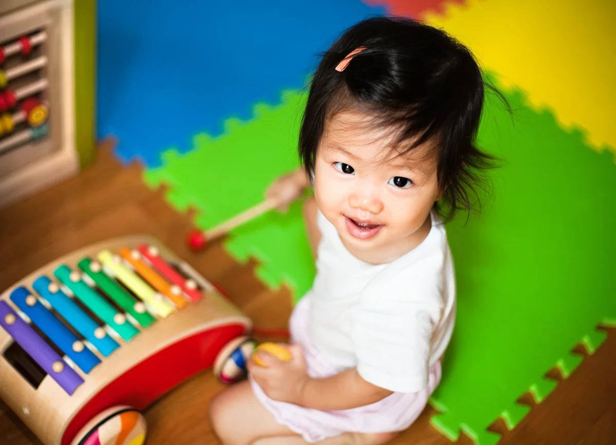Baby playing with xylophone