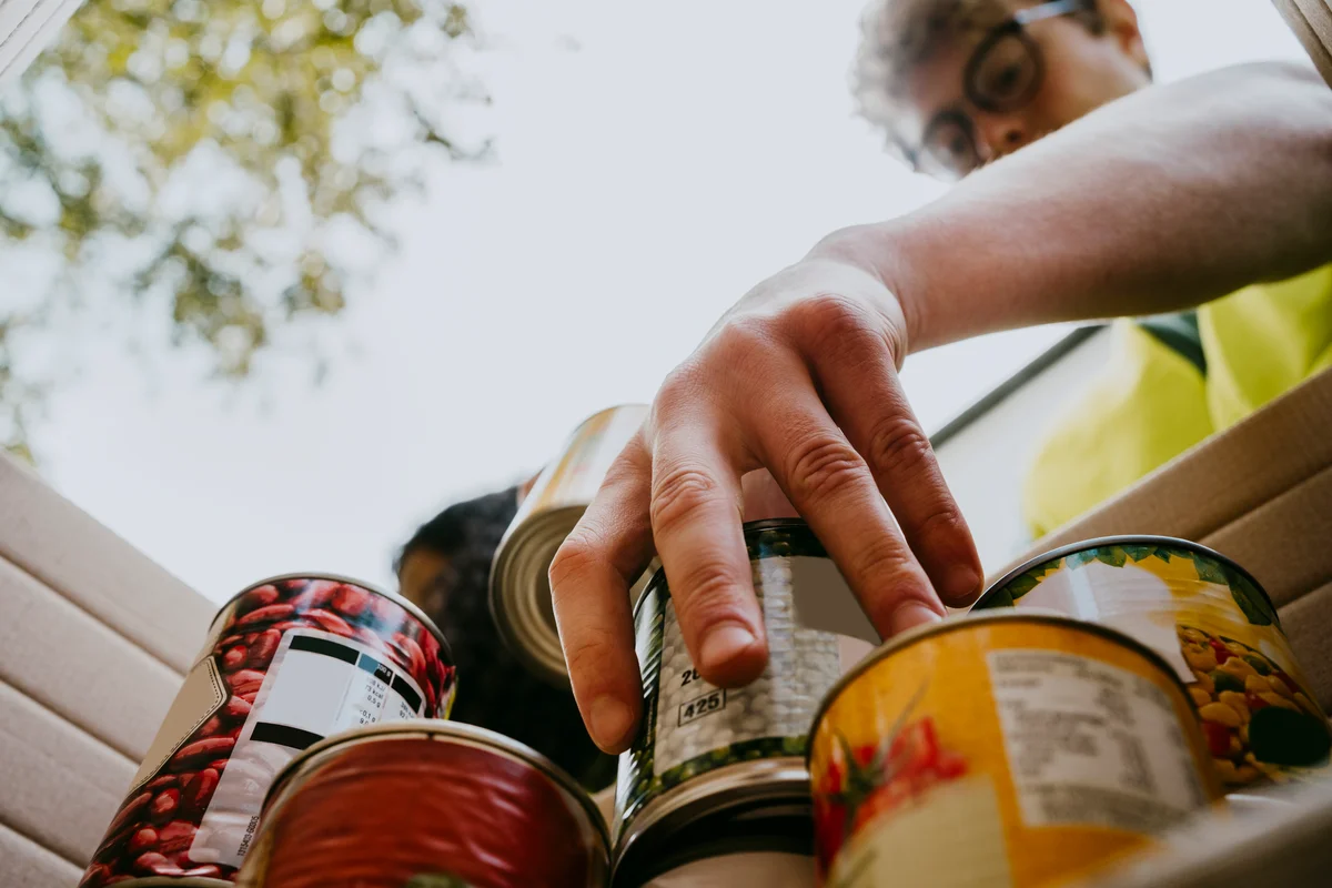 man with canned food