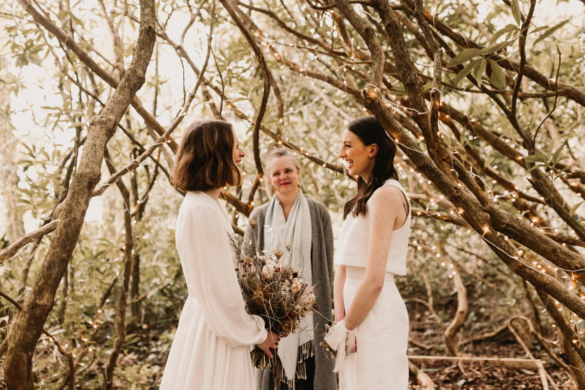 women getting married with boho fall wedding