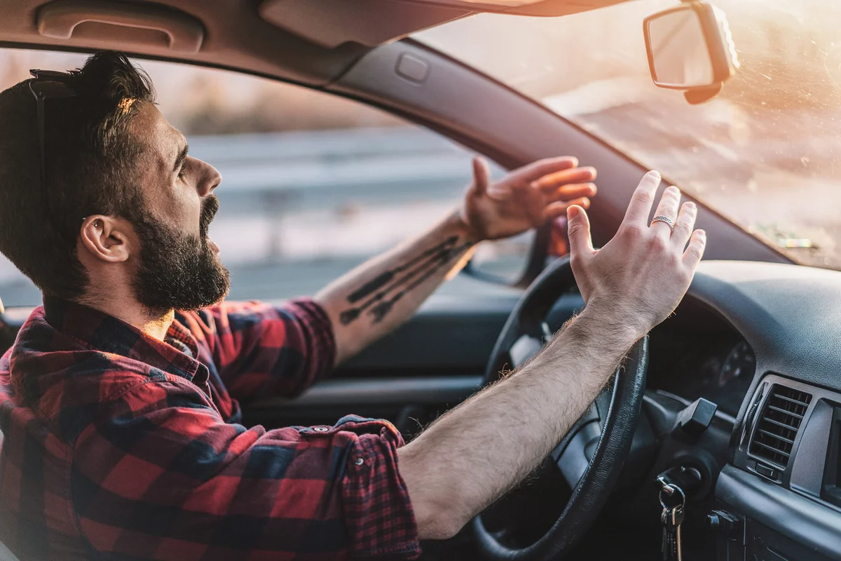Young man getting angry on the road