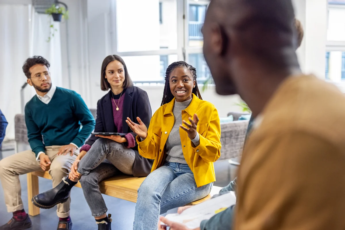Woman sharing her view during team building session