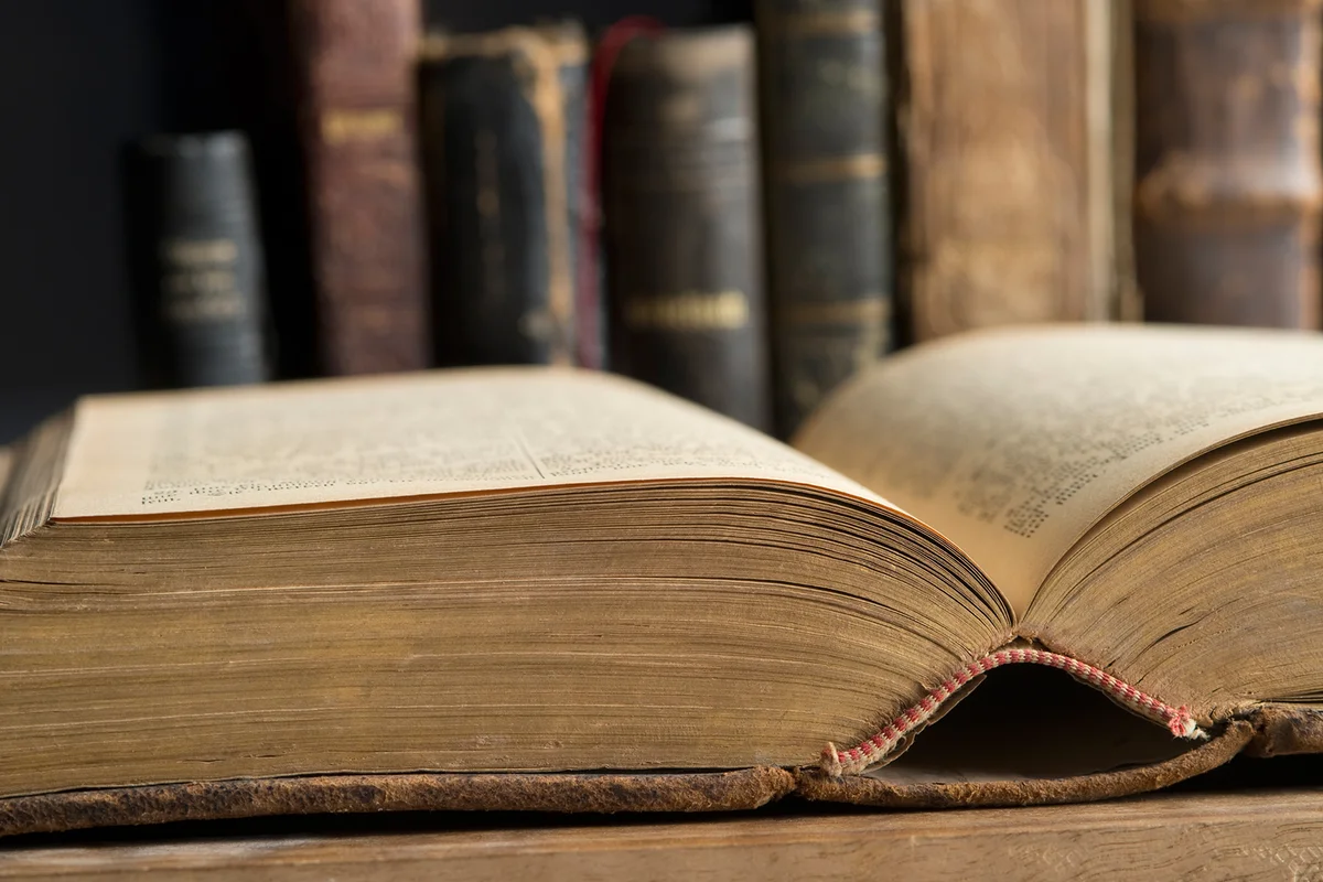 Opened book in a historic library