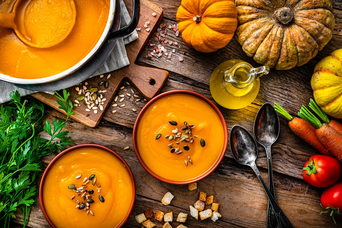 Two bowls of pumpkin soup