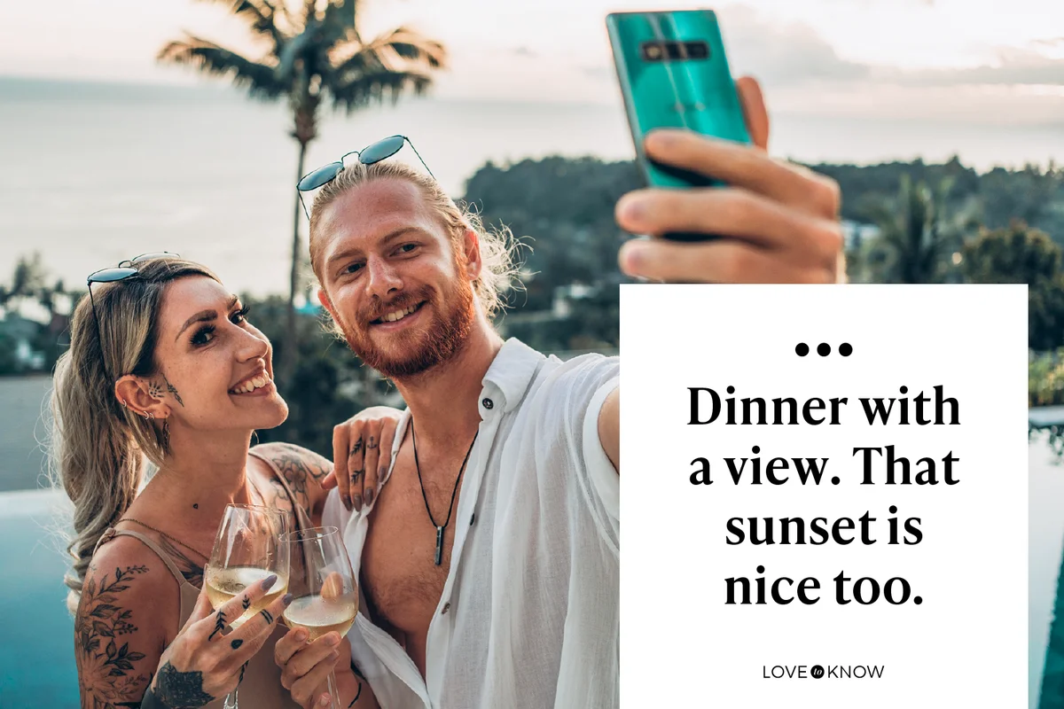 Couple in love taking selfie at sunset