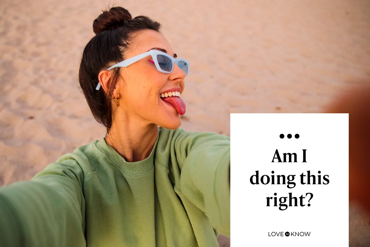 Happy woman taking selfie on the beach