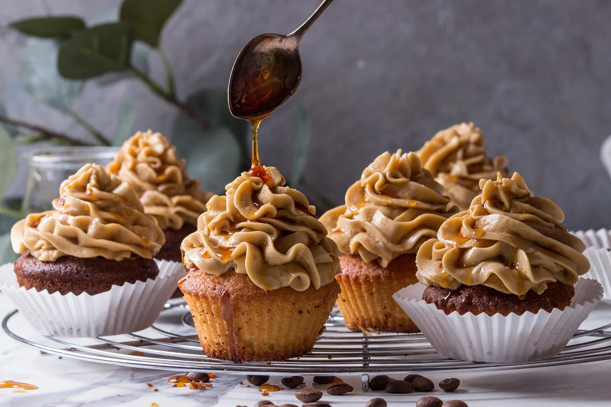 Fresh baked homemade cupcakes with coffee buttercream and caramel
