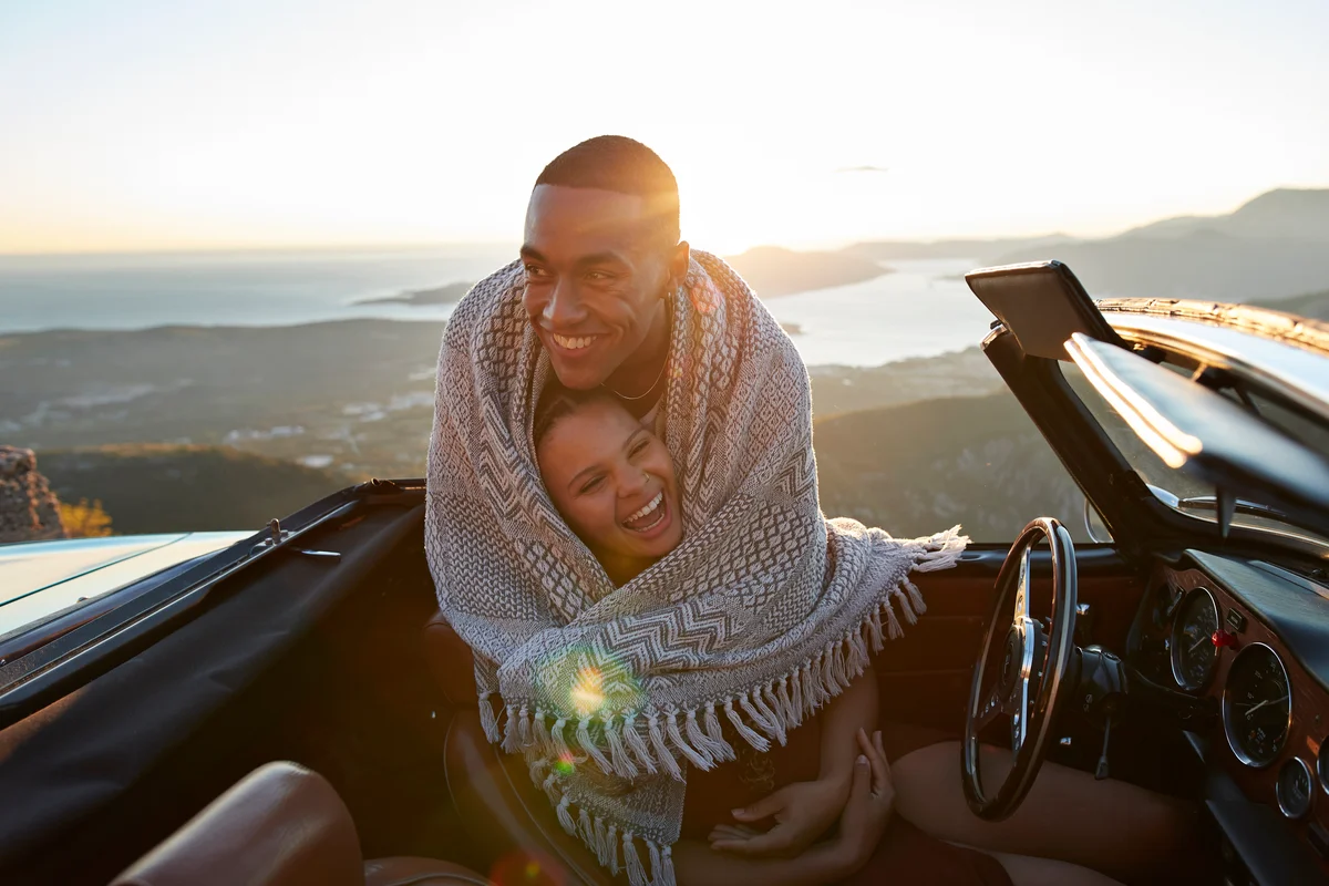 happy couple in covertible
