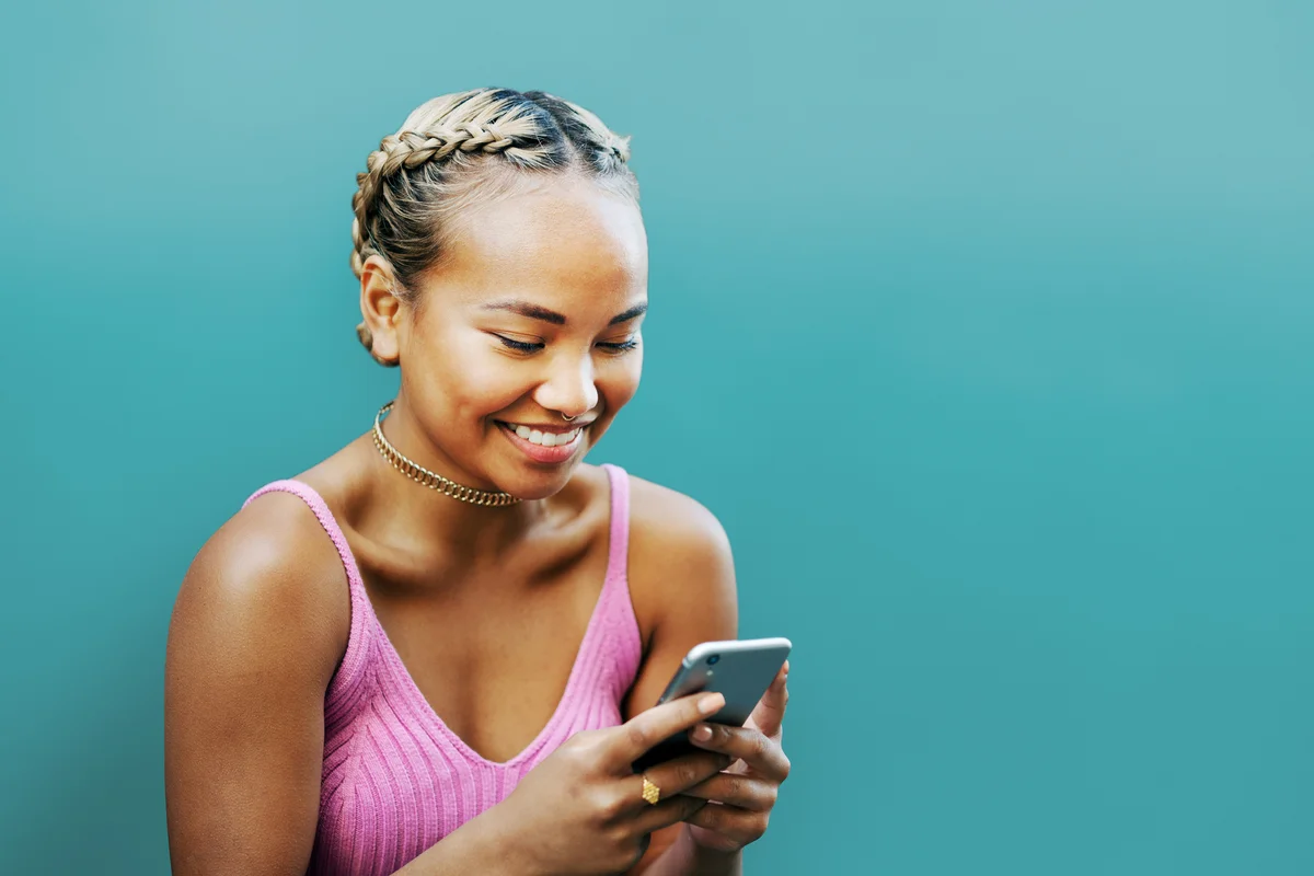 Woman smiling with smart phone