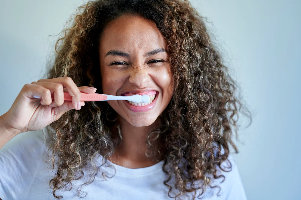 Girl brushing her teeth