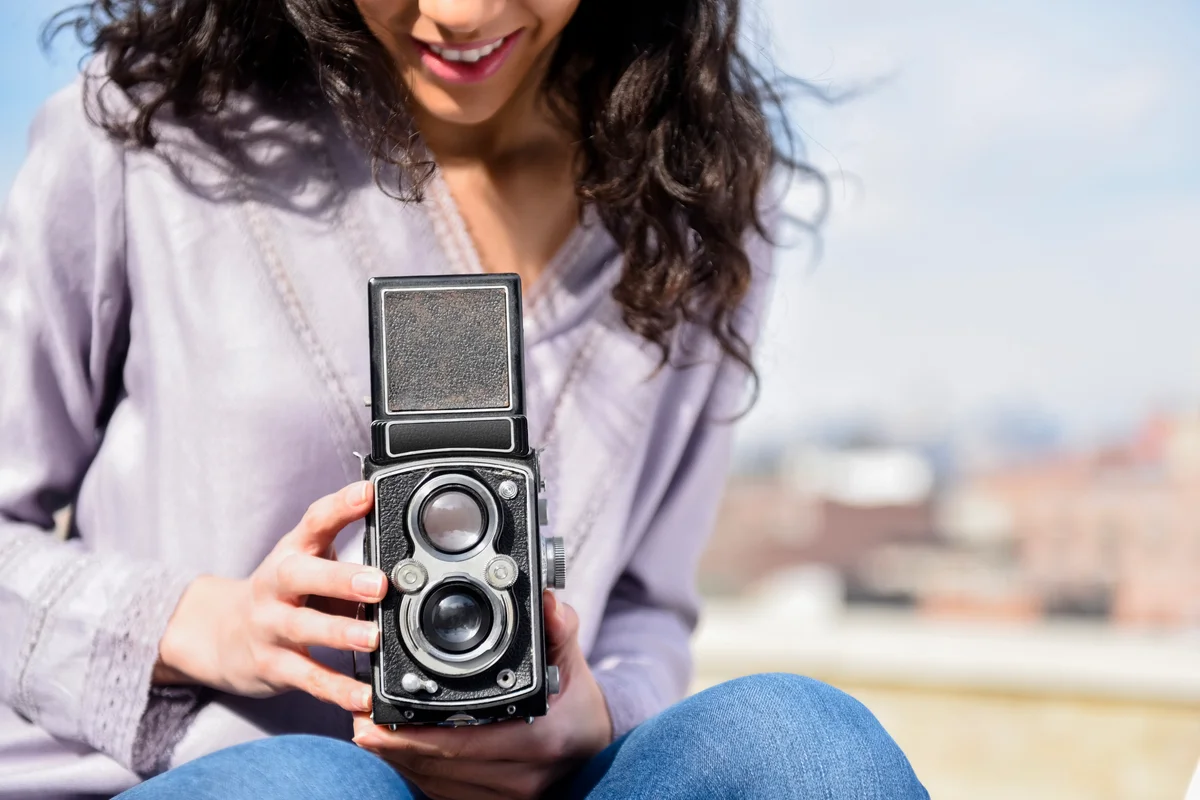 woman using a vintage camera