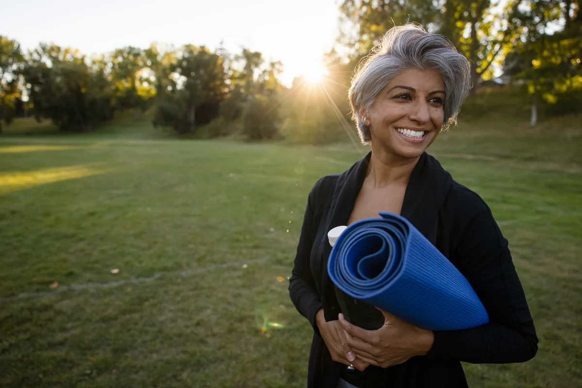woman with a yoga mat