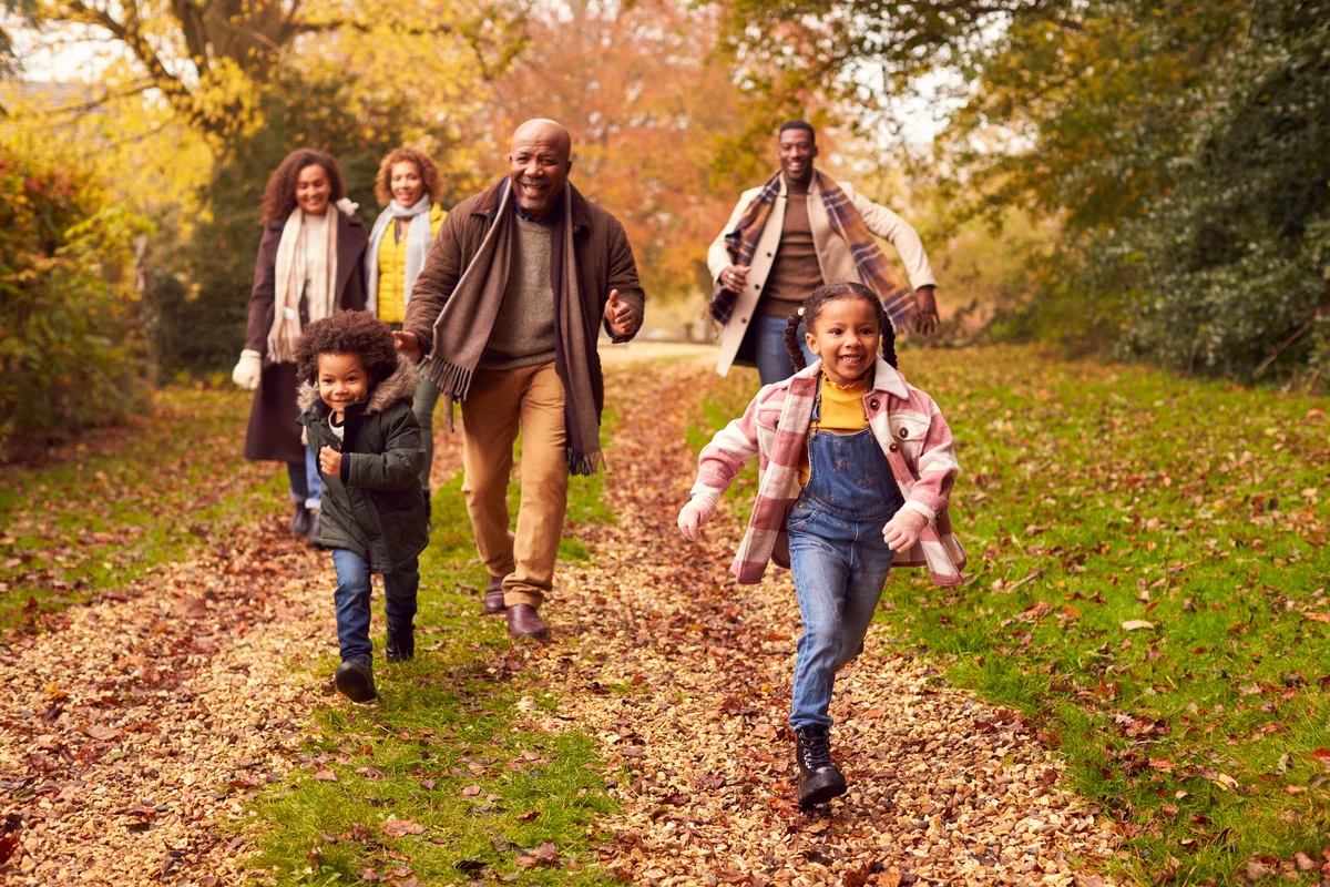 Multi-generational family enjoying a fall walk in nature