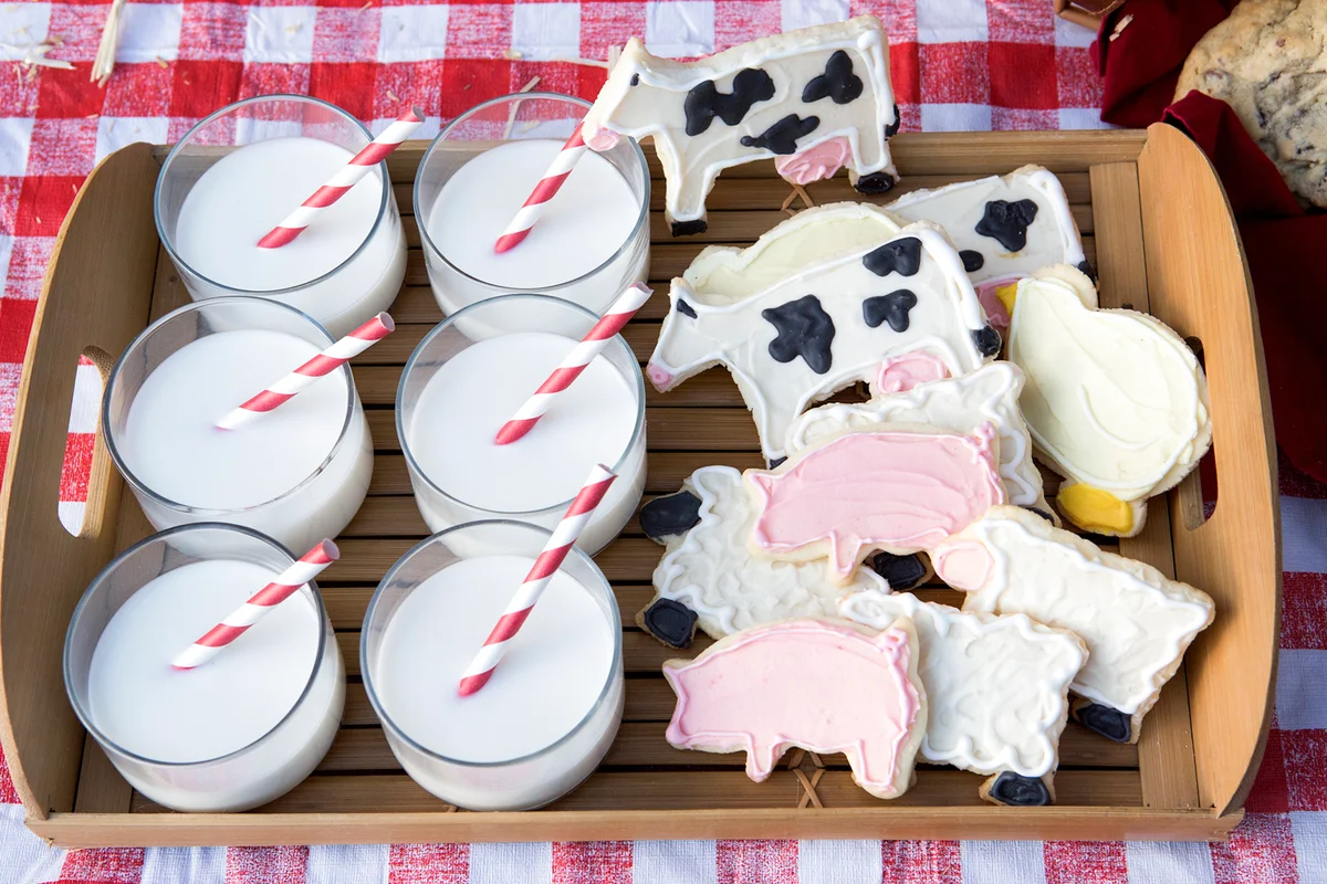 Milk and cookies on wooden tray
