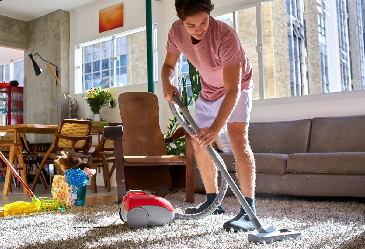 man vacuuming