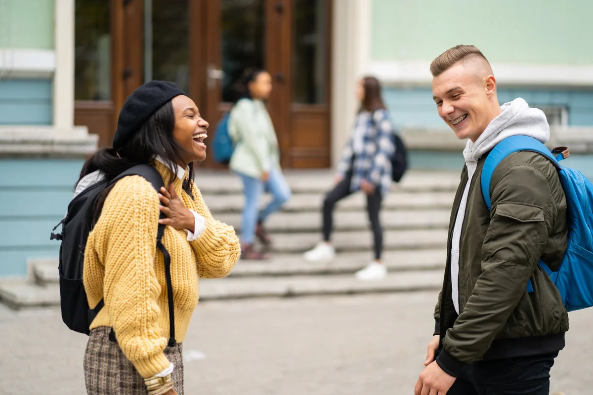 Two teens talking and laughing