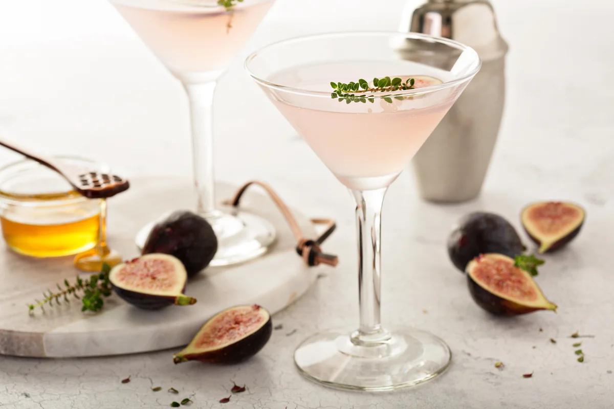 Pretty pink fig cocktail in martini glass