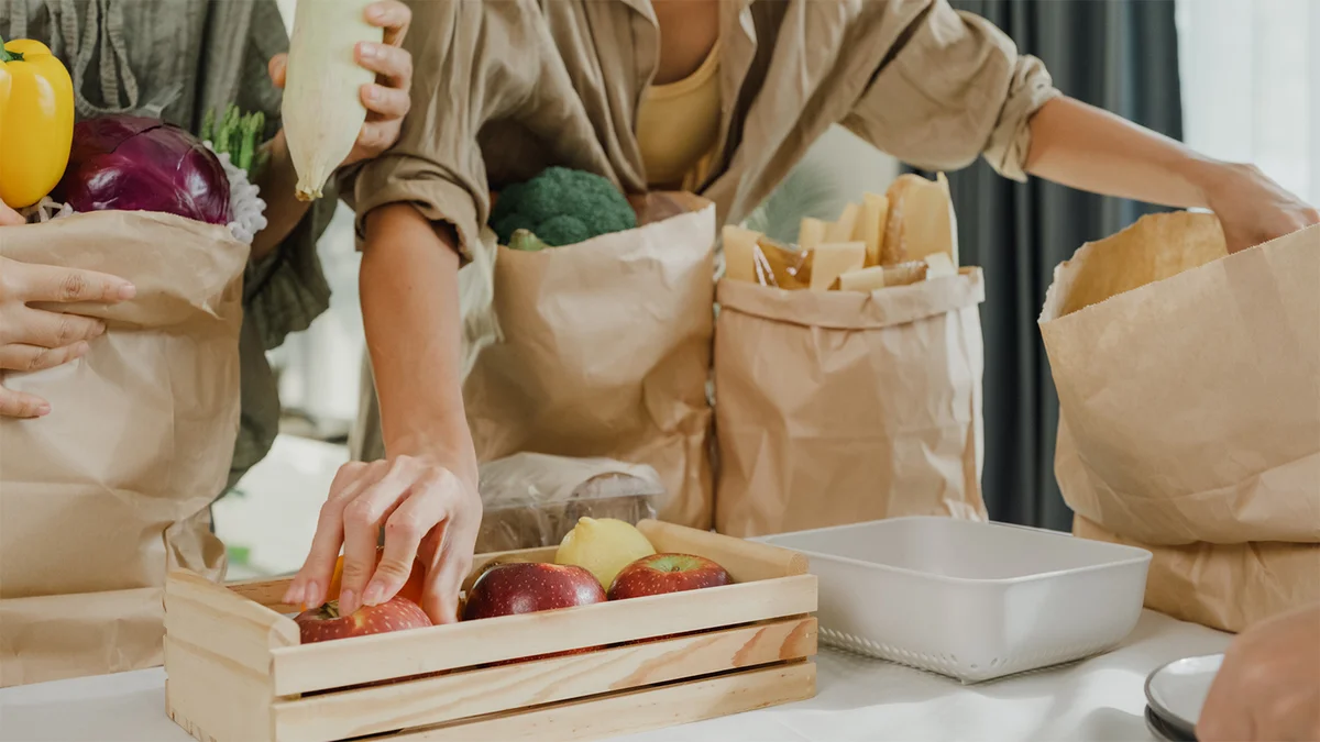 woman helping with groceries