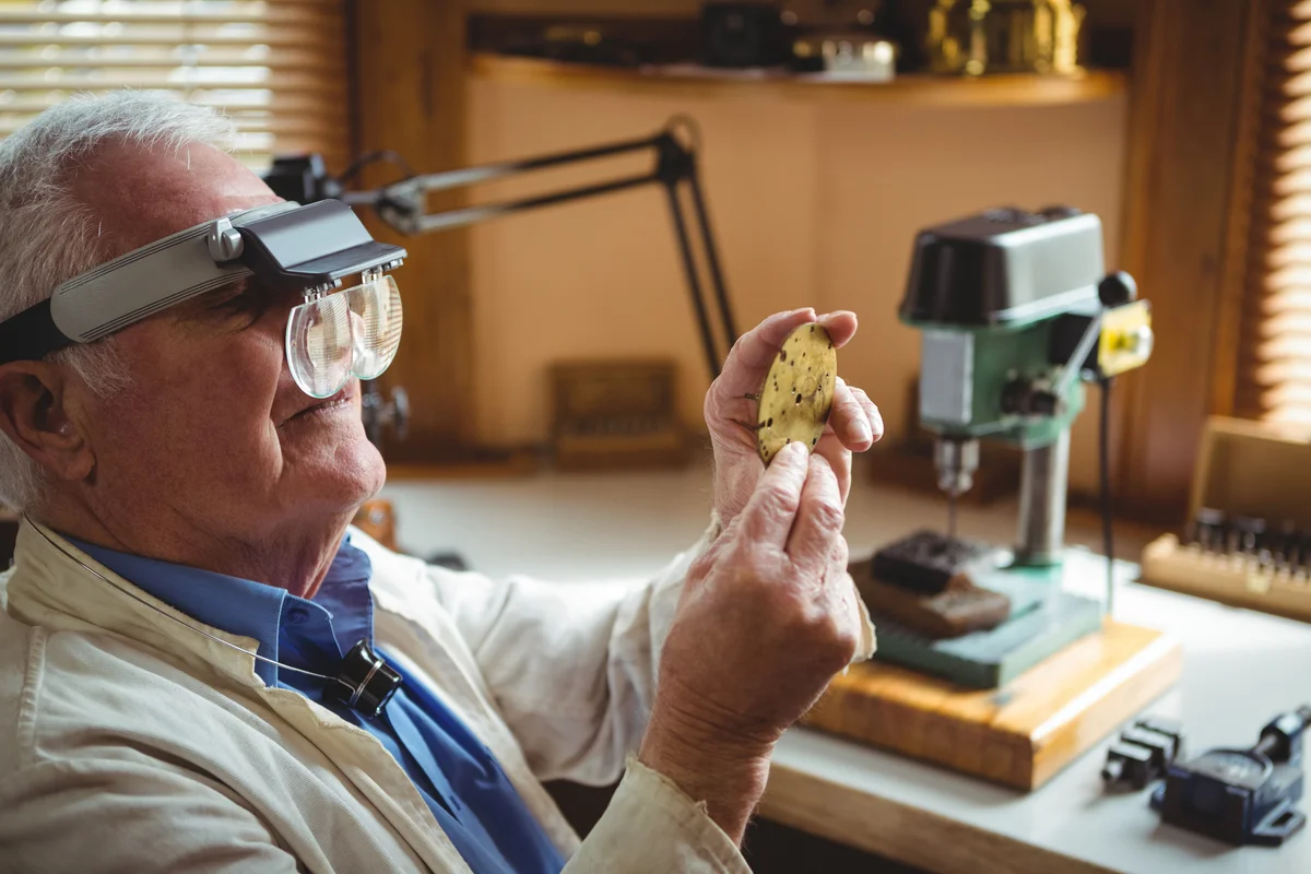horologist examining a clock