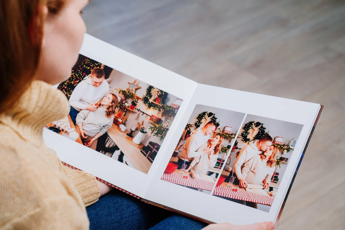 Woman watches photobook from photo shoot