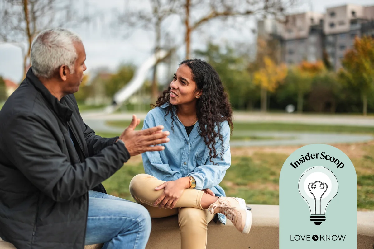 Daughter and father having a conversation outside