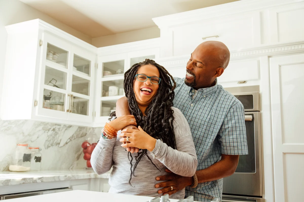 couple embracing in the kitchen