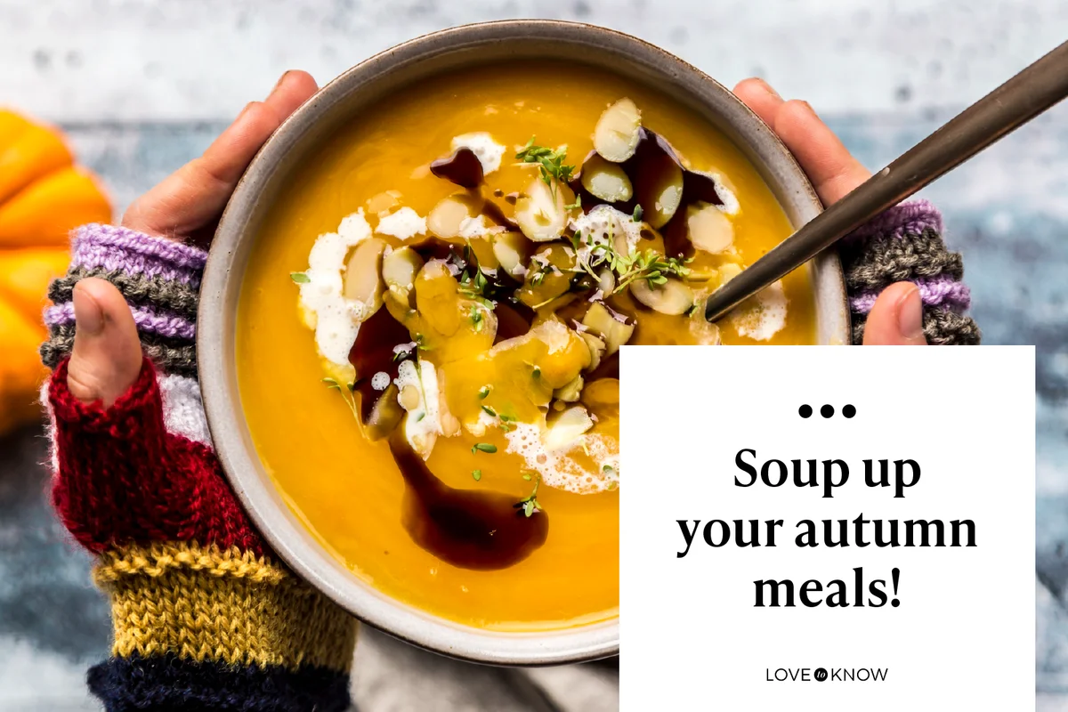 Girl's hands holding bowl of creamed pumpkin soup