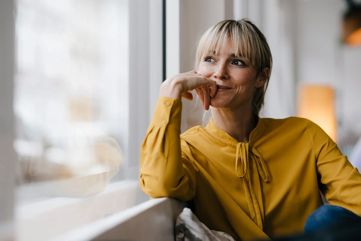 woman in mustard yellow sweater