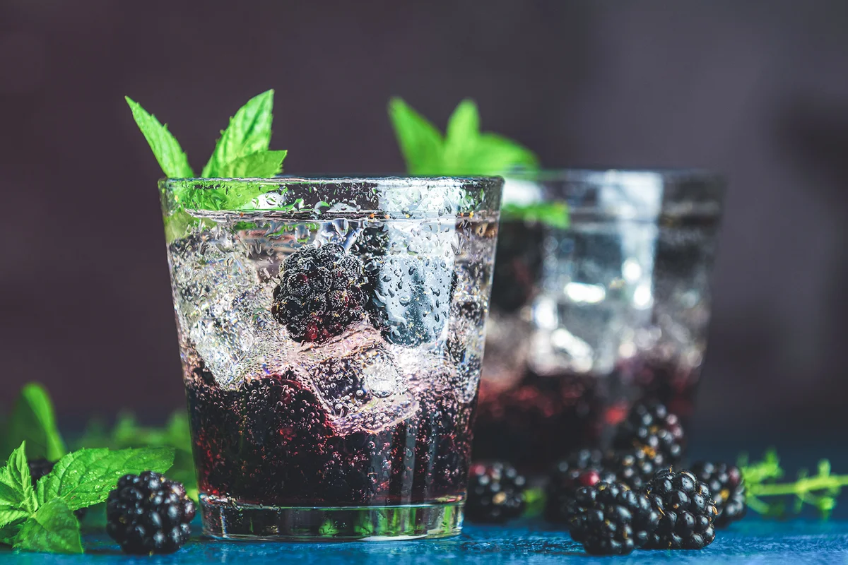 cold summer berry drink with blackberries