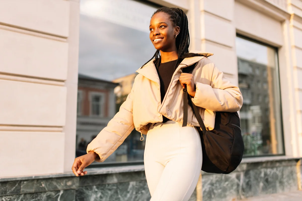 Young black businesswoman confidently strolling in downtown