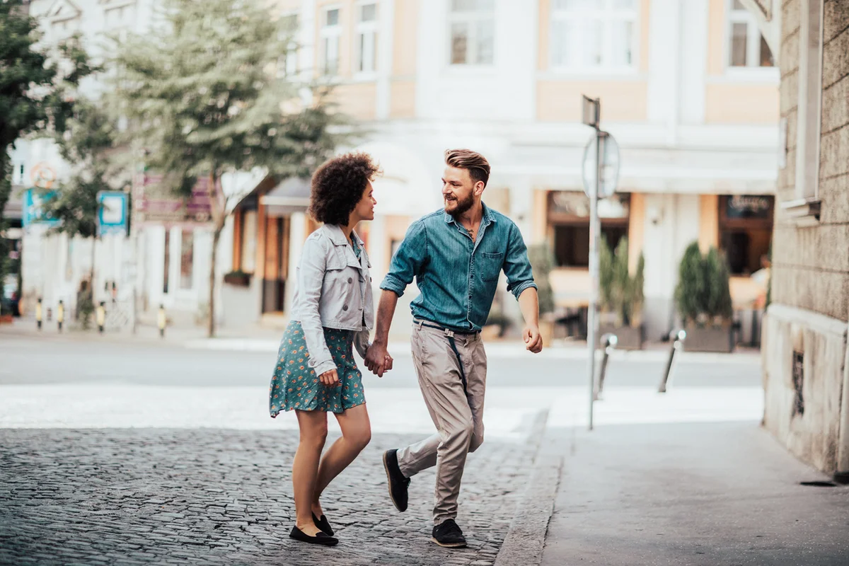 Beautiful couple crossing the street