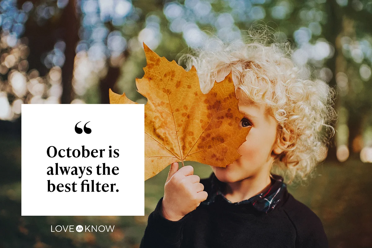 Child holding a huge leaf