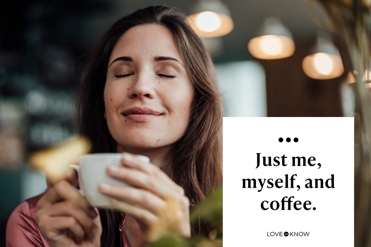 Smiling businesswoman smelling coffee in cafe
