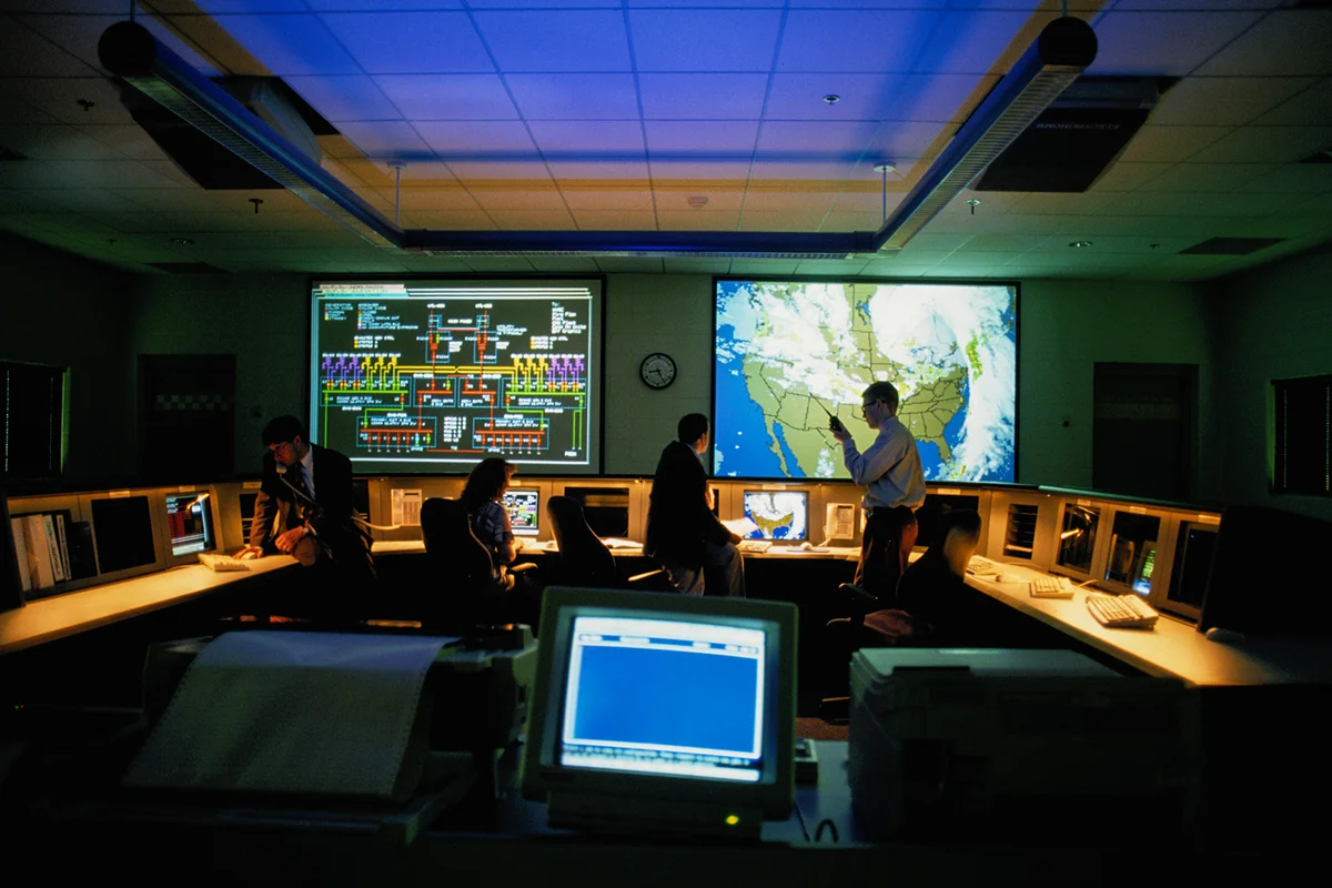 Meteorologists in a Weather Monitoring Room