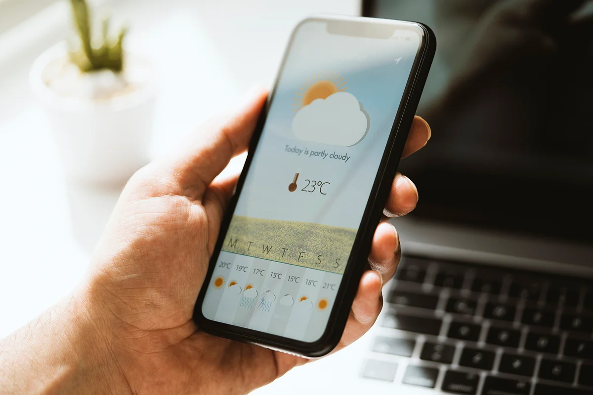 Weather forecast app on mobile phone screen
