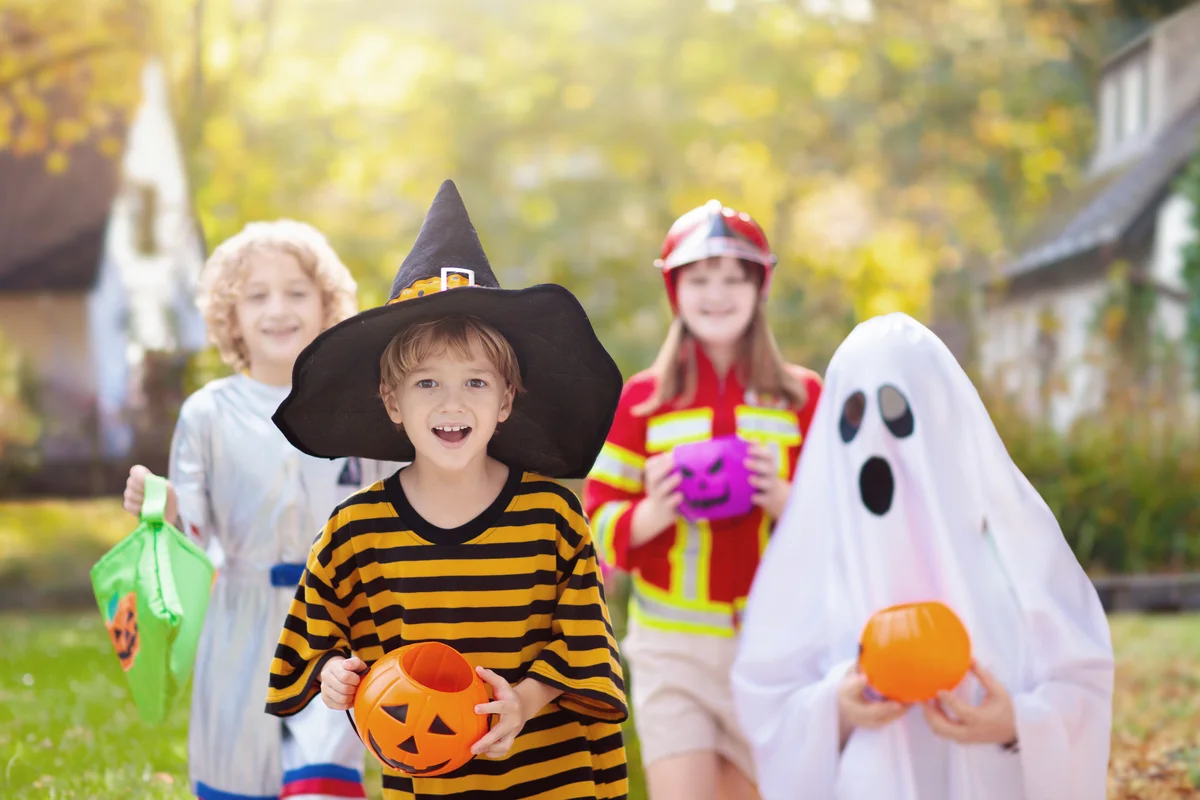 Kids trick or treat in Halloween costume