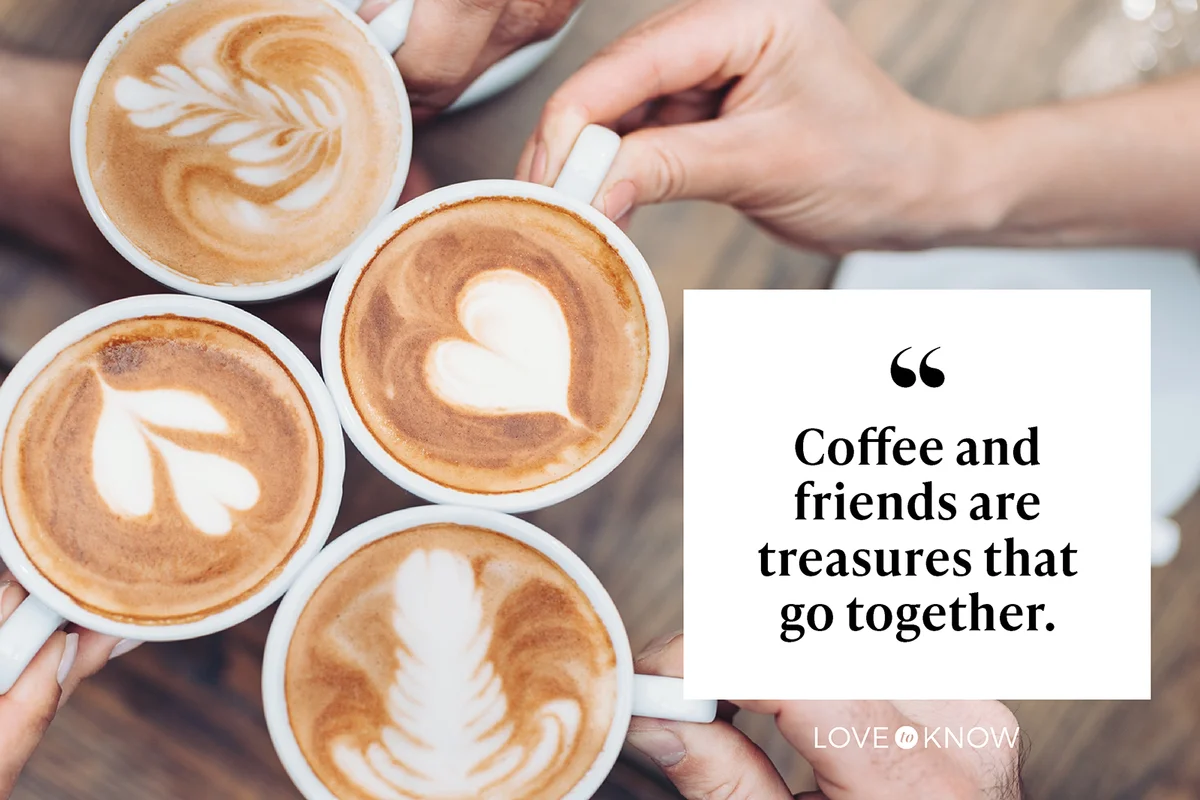 Friends hands holding cappuccino cups